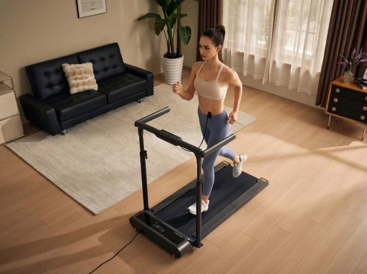 Person walking on a WalkingPad R3 Hybrid+ Foldable Treadmill in a bright living room.