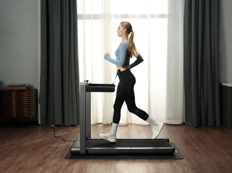 Woman using the WalkingPad X214 Foldable Treadmill indoors for running exercise.